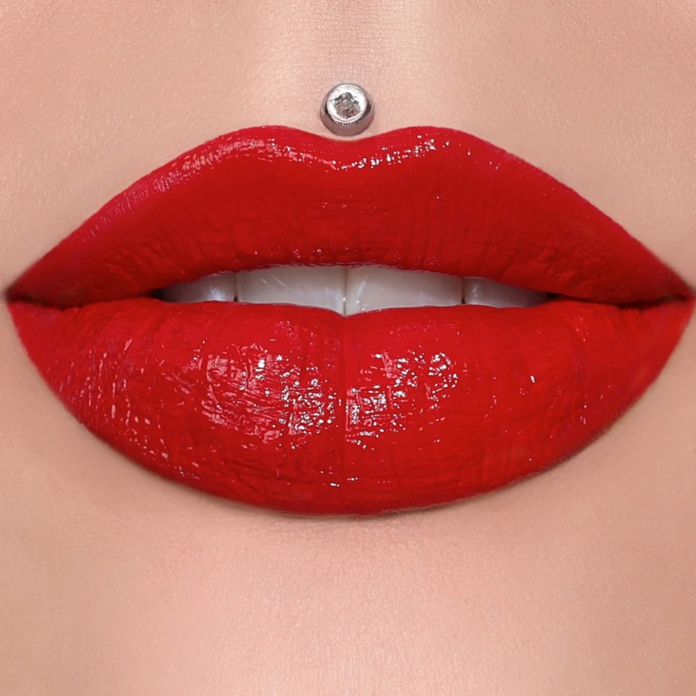 Jeffree star cosmetics. Supreme Gloss in shade “red affair”